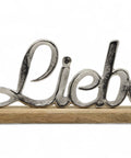 Eleganz trifft Gefühl: Aluminiumschild "Liebe" auf Holzfuß