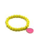 Gelbes Perlenarmband mit großem pinken Smiley-Anhänger